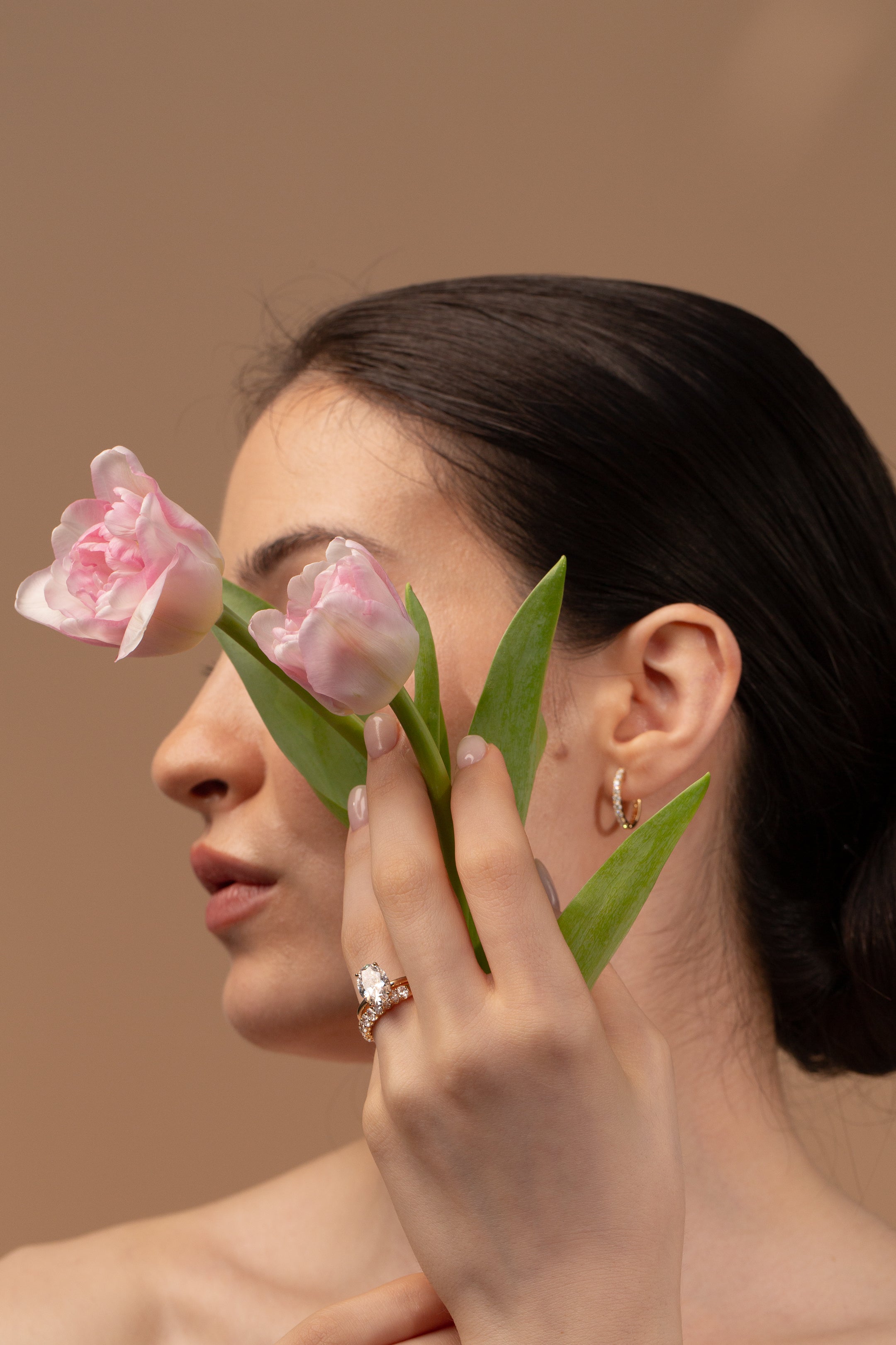 Model with flower with engagement ring