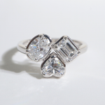 Colette | 18K White Gold Emerald, Oval, Heart Trilogy Lab Diamond Ring - The Classic Jewellers