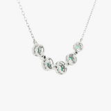 18K White Gold Emerald and Diamond Halo Necklace